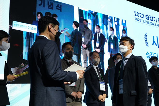 Person accepting award in South Korea