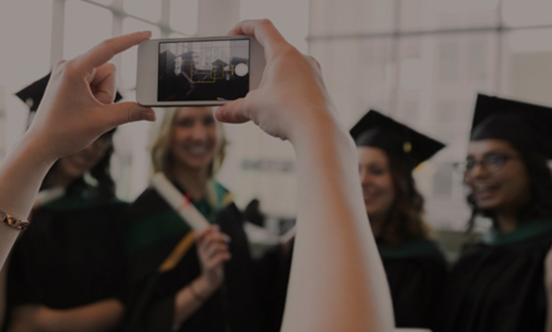 taking photo of graduate 