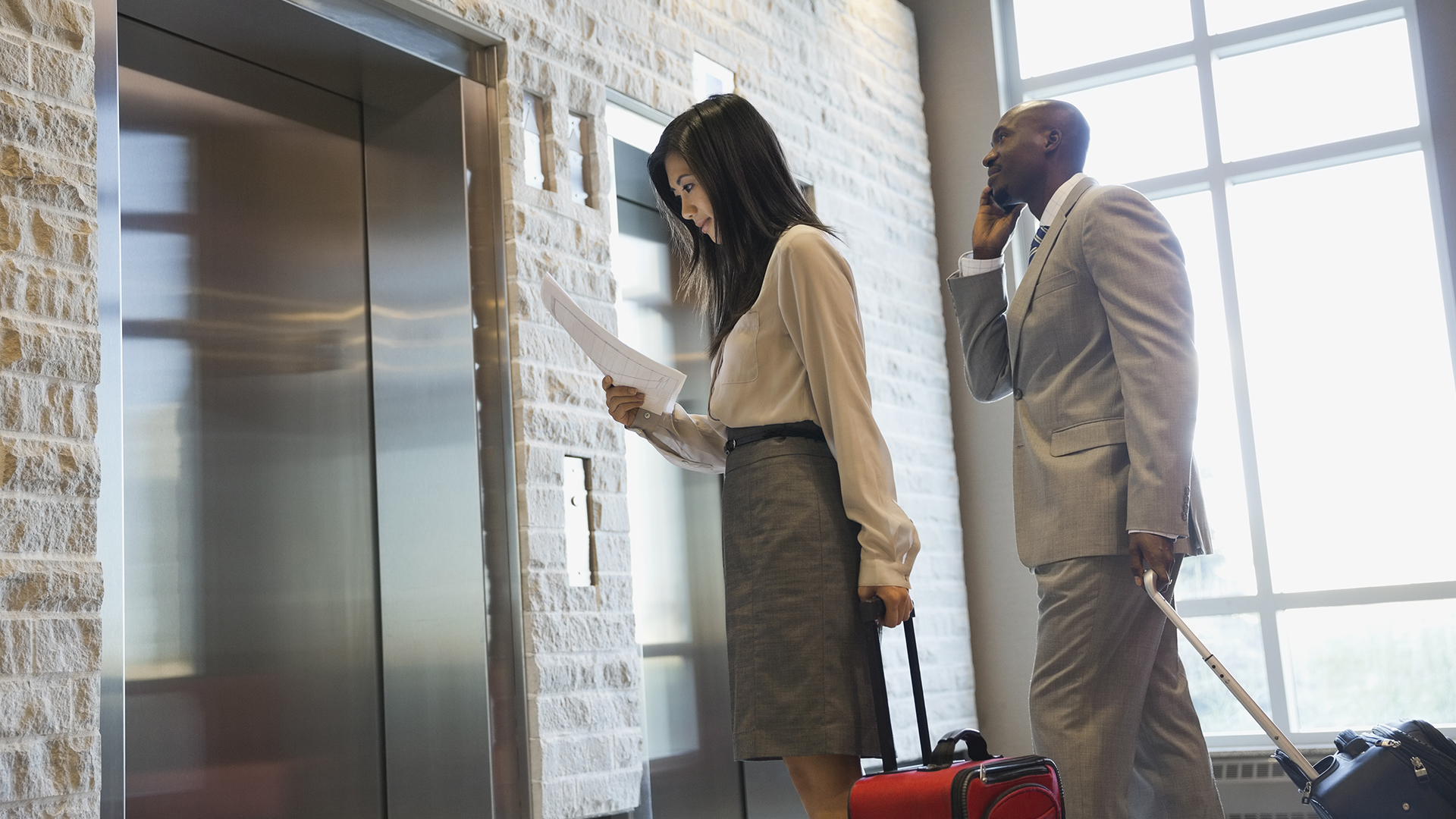 man-and-women-waiting-for-elevator