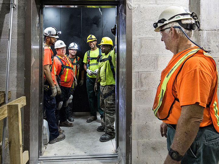 engineers in elevator