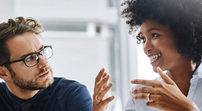 man staring at woman while women telling something