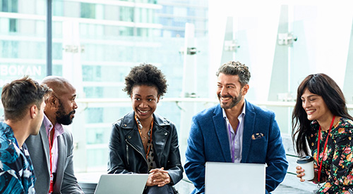 Colleagues smiling while working