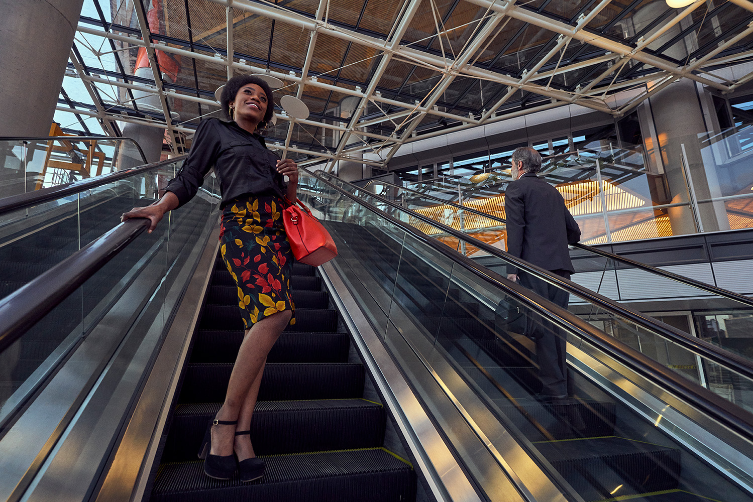 woman-walking-up-escalator-careers-new
