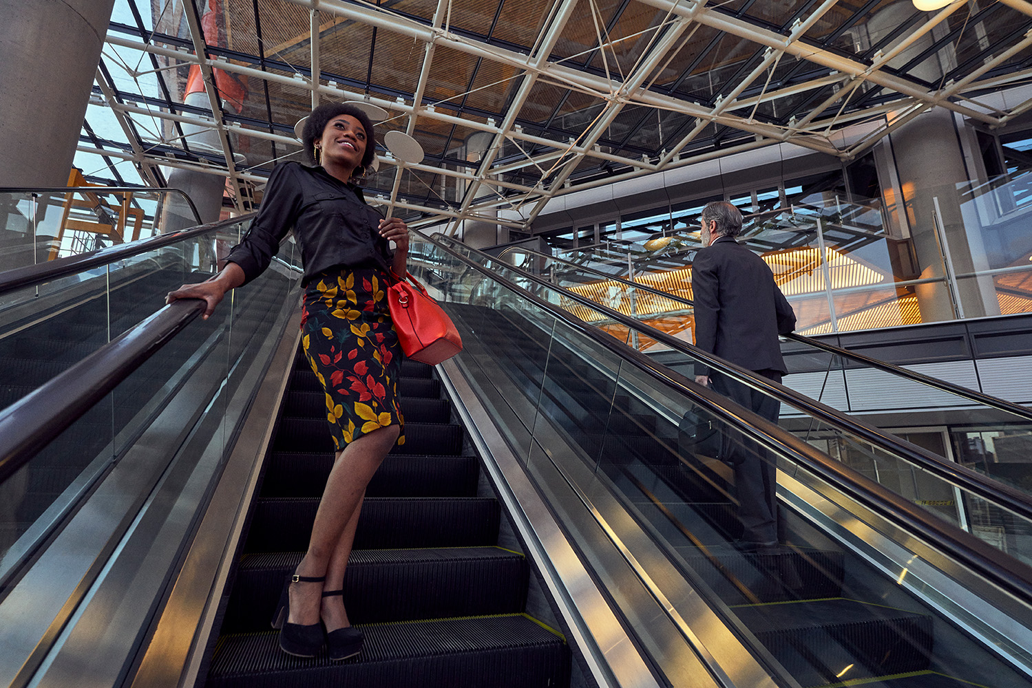 woman-going down escalator