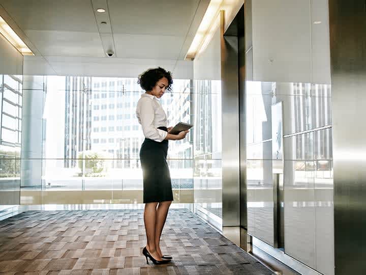 lady-waiting-for-otis-elevator