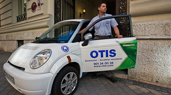 otis employee entering car