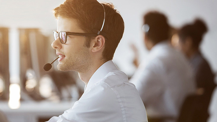 young man speaking on headset