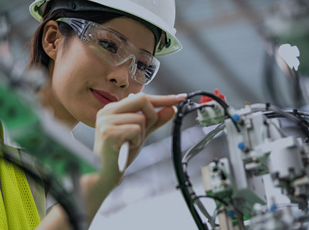 Woman working on elevator wires