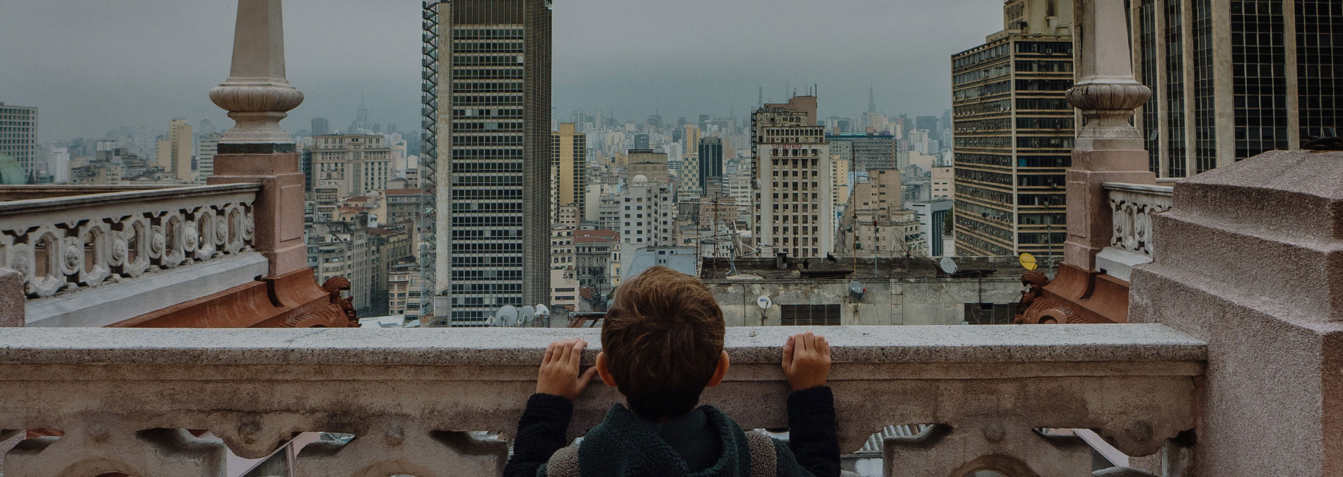 boy-looking-at-city-brazil