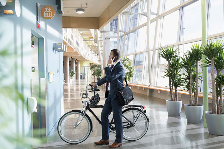 man-waiting-for-elevator-with-bike