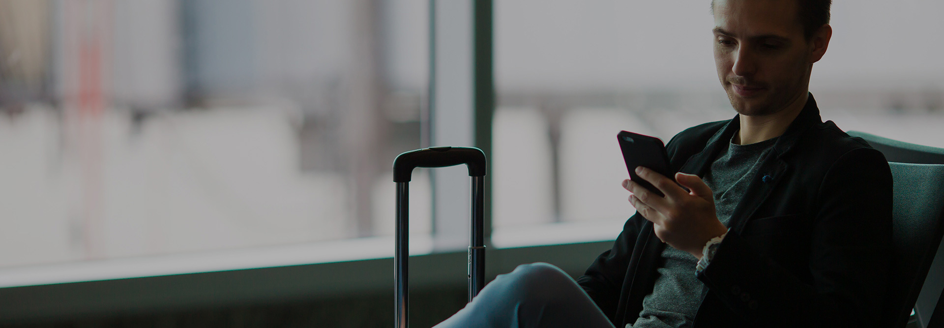 Man using phone at airport