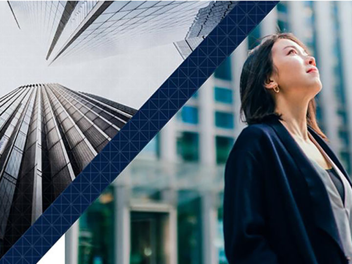 Woman looking up at tall buildings