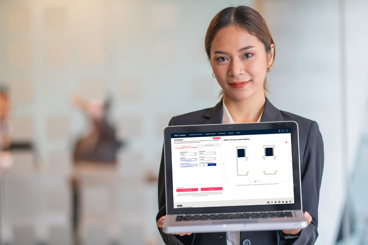 A girl holding a laptop