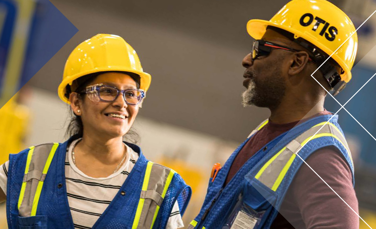 ESG at Otis image - two people in Otis hardhats