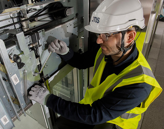 Otis technician working in the field