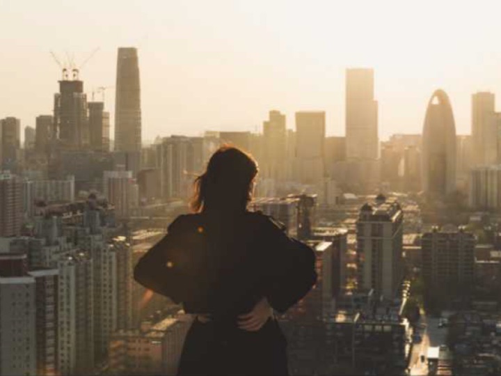 A woman viewing buildings