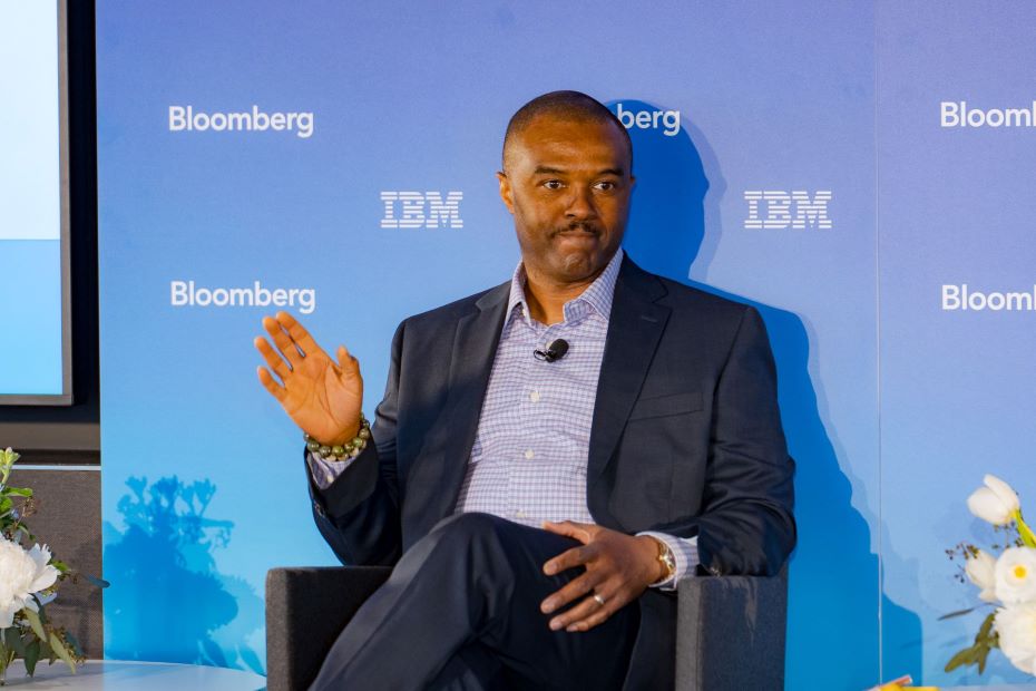 Neil Green in front of Bloomberg IBM blue sign 