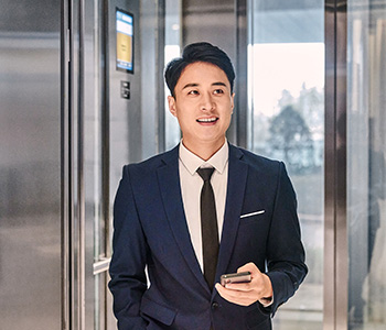 Man in suit in elevator