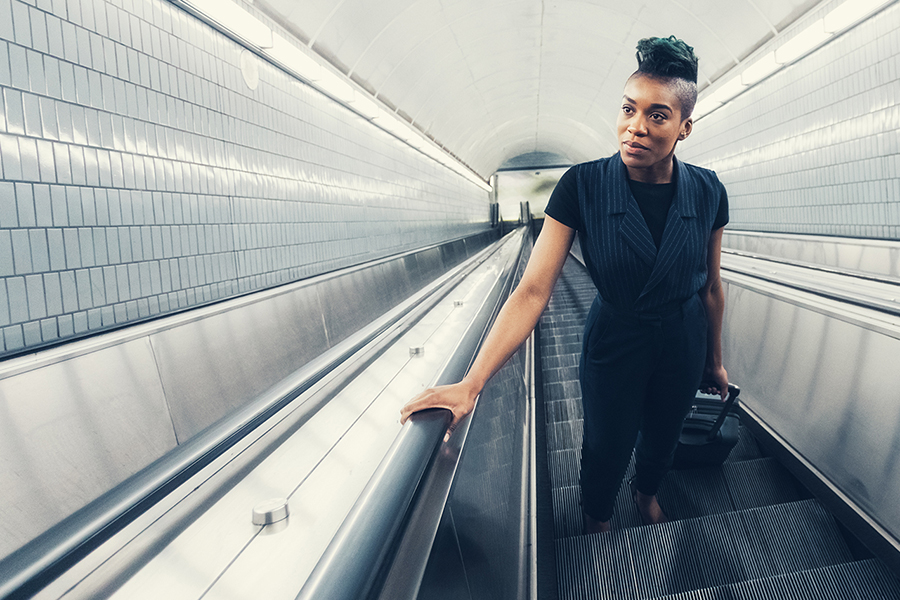 Woman going up on an escalator