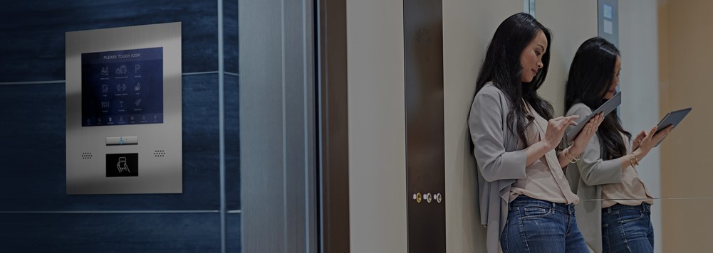 Girl Looking at tab in Elevator