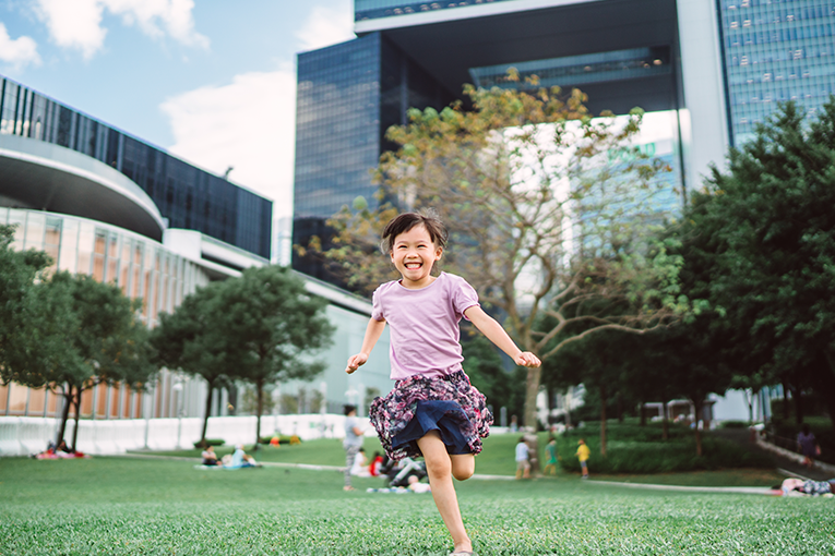 girl running in greenery