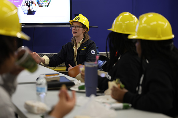 Woman in an Otis hardhat