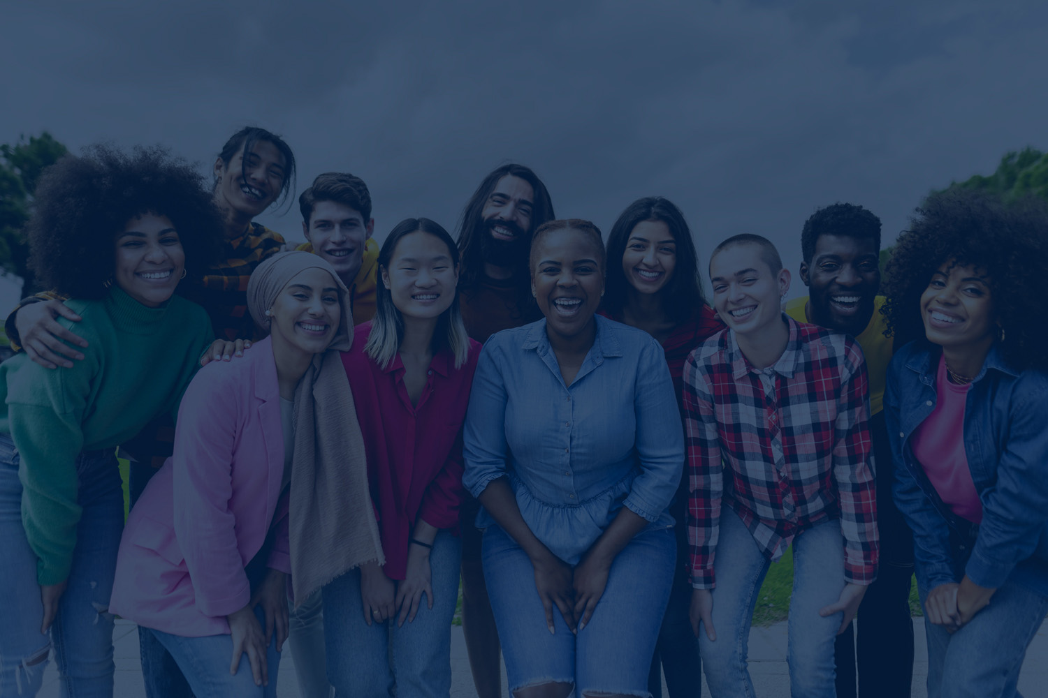 A group of community members smiling