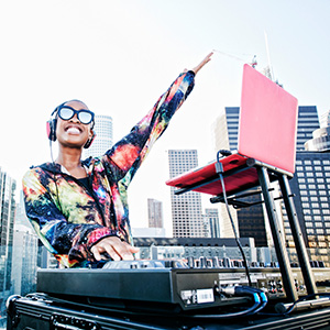 Woman dj with her arm in the air