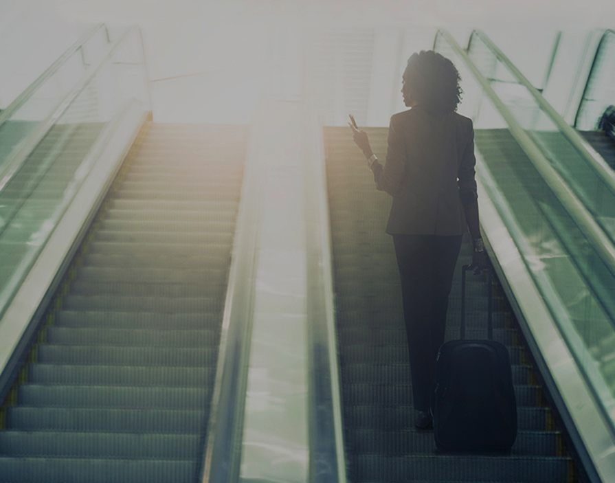 women on escalator